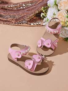“女童闪亮蝴蝶结珍珠凉鞋 – 可调节魔术贴绑带，柔软鞋垫，亮片装饰，时尚夏季派对儿童鞋履” - 粉色 - 查看 1