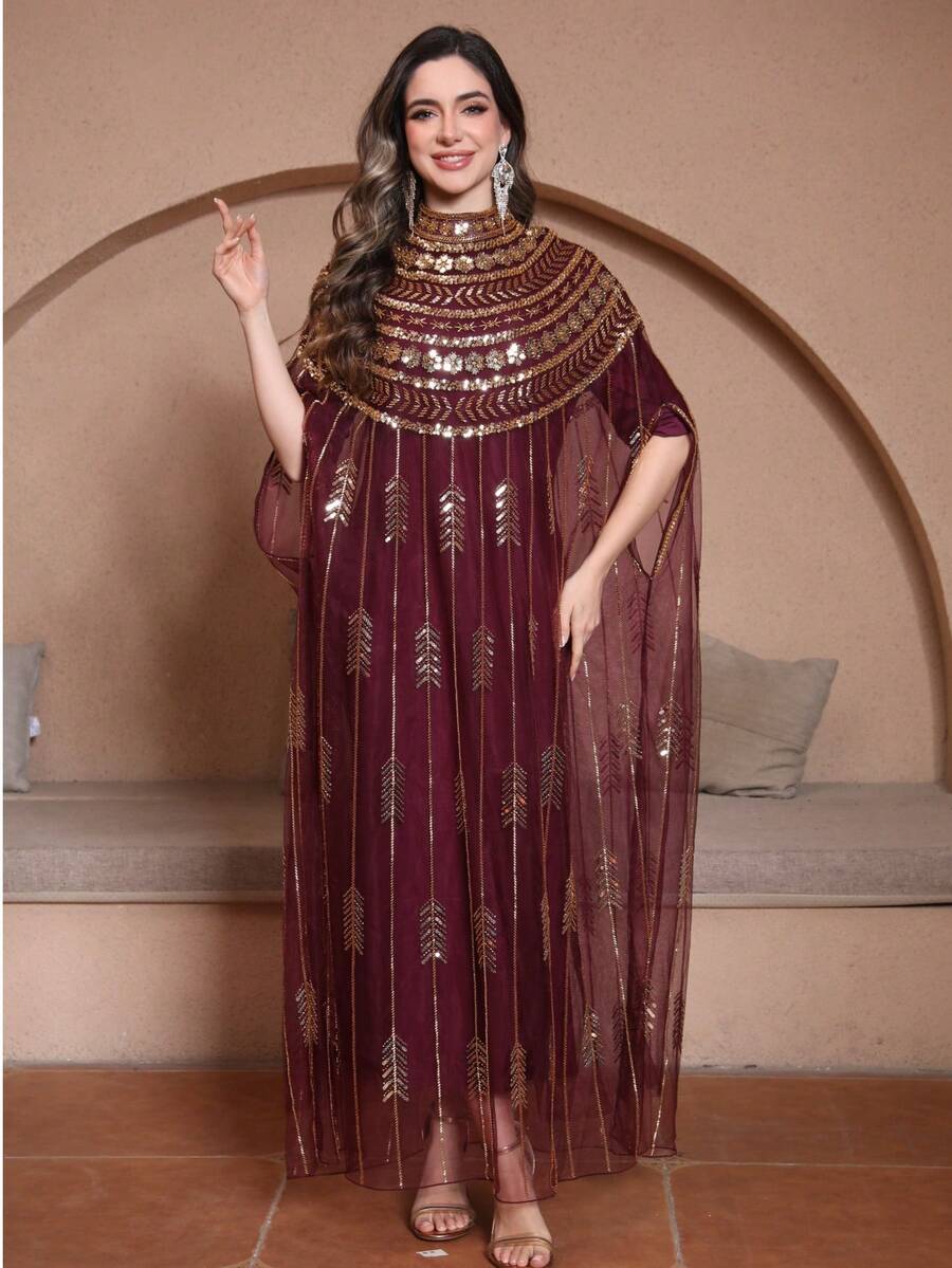 Váy kiểu Ả Rập rộng rãi màu đỏ rượu vang đính sequin.