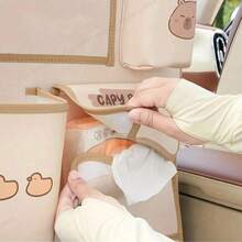 1 pieza Bolsa de almacenamiento colgante para basura de carro con diseño lindo de Capibara de dibujos animados, organizador de carro anti-patadas - A - Ver 3