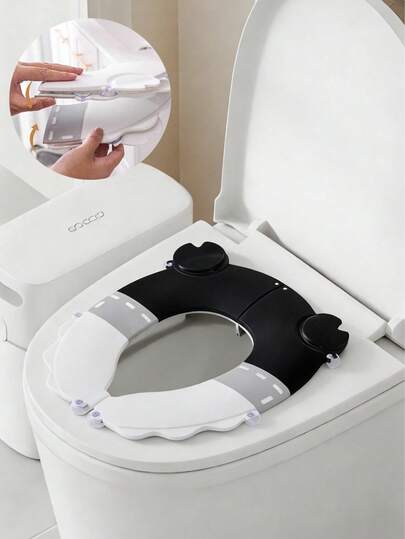 1pc Cartoon Foldable Children's Toilet Seat/Potty Training Seat/Crab Shaped Toilet Seat/Portable Toilet Seat/Home Toilet Seat/Travel Toilet Seat. Material: PP. Includes 6 Suction Cups For Increased Stability And To Prevent Shifting. Folding Seam Design To Avoid Pinching The Baby's Bottom. This Product Includes 6 Suction Cups, 1 Hook, And 1 Storage Bag (Suitable For Children Aged 3-8).