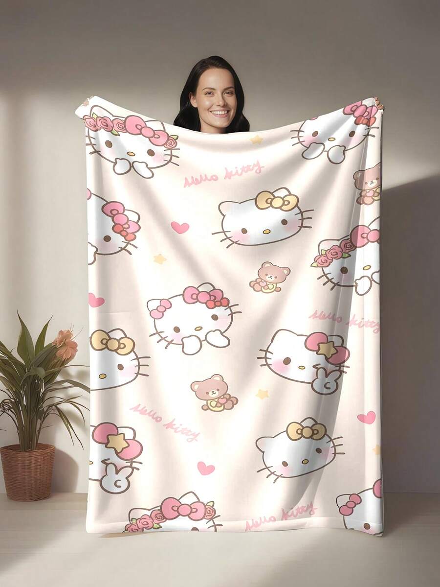 SANRIO Hello Kitty主题法兰绒毯，象牙白底色，饰以可爱的Hello Kitty图案，点缀着蝴蝶结、爱心和泰迪熊，柔软的层次感配色，清新治愈的氛围，温暖可爱的风格，适合作为礼物或家居装饰，可用作披毯、空调毯、沙发毯，非常适合沙发、卧室、露营、旅行，实用且具有纪念意义。