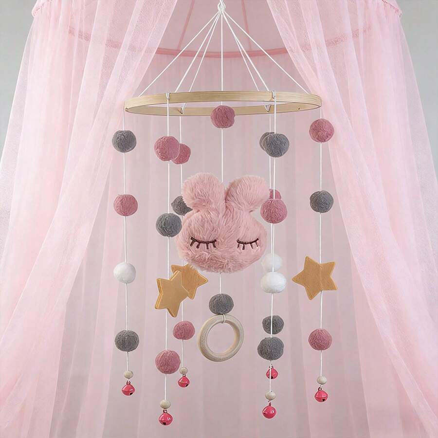 con conejo de fieltro rosa, bolas, estrellas, campanas y anillos de madera. - 1 pza. - Ver 1