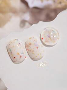 15毫升容量，2026秋冬圣诞季新款女士圣诞礼盒套装，包含流行的甜酸奶冰淇淋糖片、波点、彩色大小亮片、贝壳玻璃纸凝胶指甲油，适合四季美甲。搭配底油和封层使用，需配合UV灯使用。 - 彩色 - 查看 15