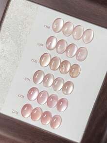 Miss Leia 1-6 15ml 春夏美甲爱心猫眼凝胶指甲油。这款百搭、显白、裸金色/金色珠光猫眼指甲油色彩丰富，适合初学者。UV/LED灯固化，可浸泡，打造半永久性美甲效果。是美甲沙龙、美容院、DIY项目、节日派对以及送给女性的理想礼物。也适用于美甲用品。 - 裸粉色 - 查看 3