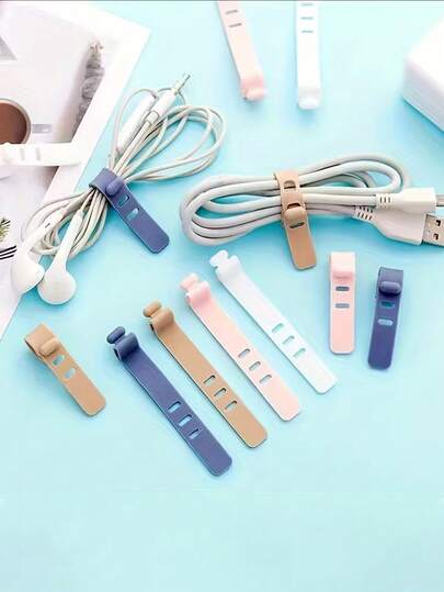 可重复使用的硅胶理线器 - 高弹性理线带，适用于耳机、USB充电器和电子产品，耐用塑料材质，多种颜色可选（黑色、粉色、浅蓝色、白色），理线器