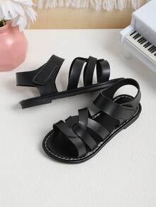 1双黑色防滑厚底优质PU皮鞋面交叉旋转设计时尚儿童平底凉鞋，复古简约风格魔术贴搭扣，适合搭配公主裙和连衣裙，男女童均适用，适合3-16岁学生日常穿着，生日派对、假期、海滩等场合，2026春夏新款。 - 黑色 - 查看 5