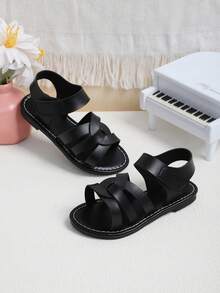 1双黑色防滑厚底优质PU皮鞋面交叉旋转设计时尚儿童平底凉鞋，复古简约风格魔术贴搭扣，适合搭配公主裙和连衣裙，男女童均适用，适合3-16岁学生日常穿着，生日派对、假期、海滩等场合，2026春夏新款。 - 黑色 - 查看 6