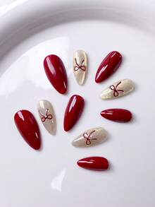 10片手工制作的短款杏仁形假指甲，法式美甲贴纸，红色、粉色、紫色可选，可爱设计，带有猫眼效果和闪粉点缀，蝴蝶结和撞色图案，时尚简约风格，附赠美甲工具，适合秋冬季女性和女孩的美甲用品。 - 彩色 - 查看 14