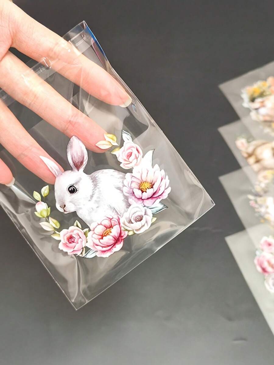 100个复活节兔子和花朵图案礼品袋，可爱兔子和春花图案透明自粘包装袋，4种不同图案混合装 - 非常适合复活节和主题派对礼品包装等。 - 彩色 - 查看 1
