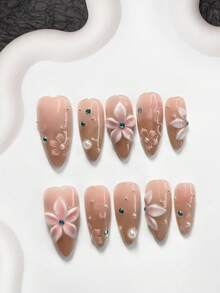 10件套凝胶美甲套装，亚克力美甲套装，包含手工制作的五瓣渐变粉色花朵、不对称白色水钻美甲装饰、手绘粉色花卉图案、银色猫眼设计，适合女士和女孩的手工按压式美甲贴片。 - 彩色 - 查看 3