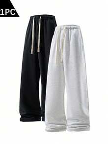 男士宽松时尚运动裤，休闲简约纯色阔腿设计，腰部配有抽绳和大口袋，轻便舒适，适合日常步行、工作、旅行等场合。