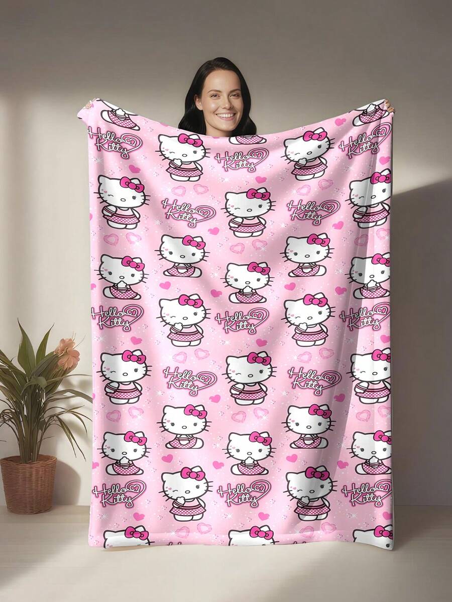 SANRIO 这是一条Hello Kitty主题的法兰绒毯。Hello Kitty身穿格子连衣裙，系着粉色蝴蝶结，点缀着粉色爱心，更添少女气息和治愈感。浅粉色调和爱心元素强化了这种甜美治愈的感觉。满版印花设计视觉饱满，富有韵律感。毯子温暖柔软，可用作沙发毯、午睡毯或床上装饰。