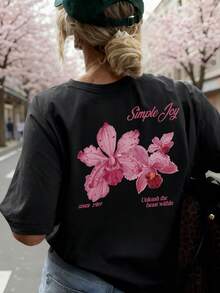 This Colorful Floral & Letter Print Round Neck T-Shirt For Women Is Fashionable And Versatile For Summer. The Graphic Tee Comes In White And Pink, Suitable For Vacation Wear. Casual Black - Black - View 6