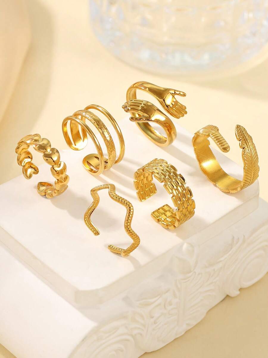 6枚18K镀金不锈钢可调节戒指,造型包括羽毛、心形和手掌,适合女性日常佩戴或作为礼物。 - 金黃色 - 查看 1