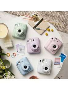 FujiFilm The Mini12 Instant Camera Weighs Only 306g, Making It Lightweight And Portable. Features Include A Rotating Power Button, One-Button Mode Switching, Optimized Parallax Auto-Dimming, And A Built-In Flash For Instant Everyday Snapshots. - Iris Purple - View 2