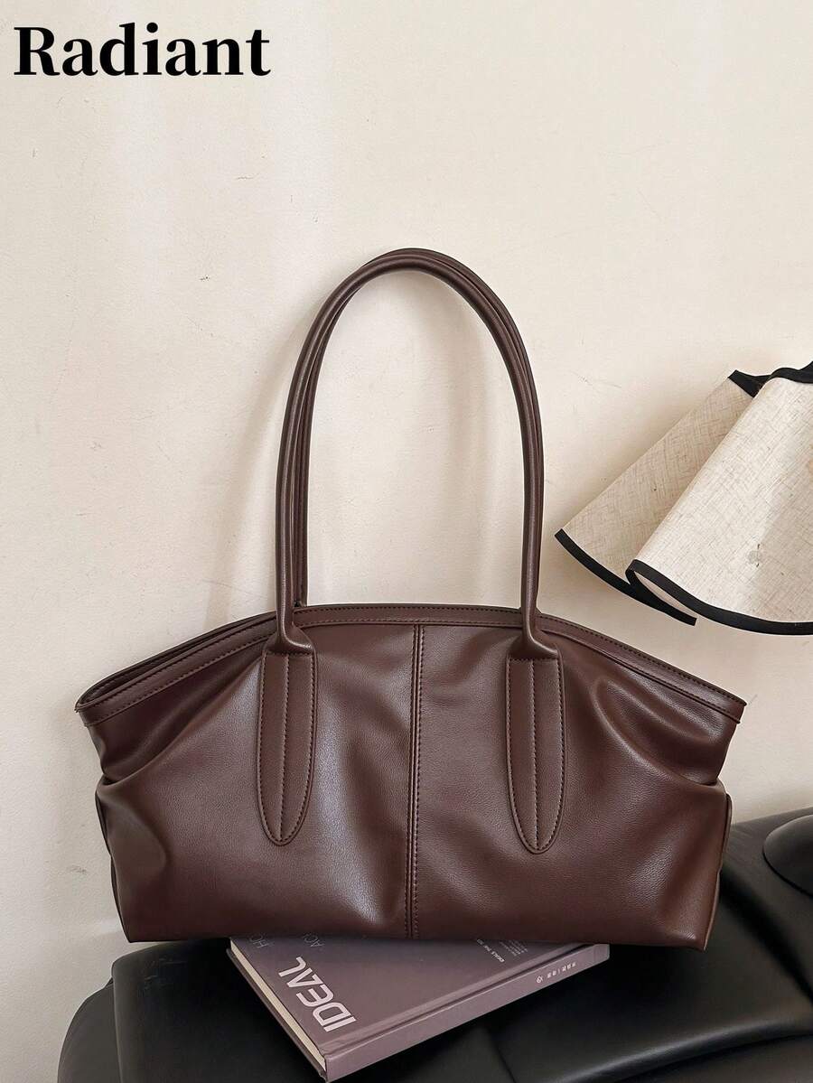 这款简约大容量手提包采用拉链封口，是一款多功能、时尚的女士单肩包，适合外出、短途旅行、购物、通勤、送礼和聚会等各种场合。