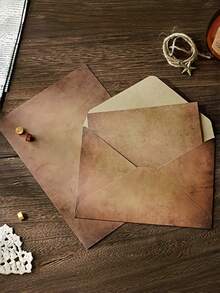 这款复古风格的仿牛皮纸信封套装，配有麻绳和金属装饰，包含10张A5手写情书、2个信封、2根绳子、2个装饰配件和4张信纸。它非常适合用作邀请函、情书和派对回礼，是送给爱人、朋友、家人和同学的理想礼物。 - 彩色 - 查看 3