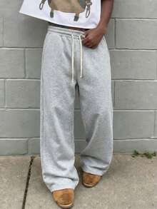 1 chiếc quần thể thao nam dáng rộng, màu trơn, ống rộng, có dây rút ở eo và túi lớn, thích hợp cho đi bộ hàng ngày, đi làm, du lịch và các dịp khác. - Màu Xám nhạt - Xem 3