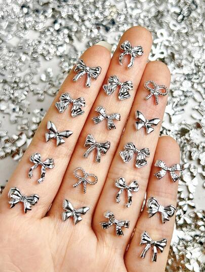 20Pcs Random Mixed Silver Alloy Bow Nail Charms Y2K Metal Pompom Bow Butterfly Hollowed-Out Bow Versatile Nail Art Accessories DIY Nails Nail Supplies
