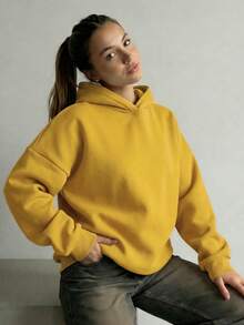 Thiết kế tối giản, áo hoodie dài tay rộng rãi, màu trơn thoải mái dành cho nữ, phù hợp cho mùa thu/đông, là món đồ không thể thiếu trong tủ quần áo, trang phục thường ngày, công sở và giải trí, áo kiểu casual giúp thon gọn vóc dáng, áo sweatshirt mềm mại và thoải mái, đồ cần thiết cho kỳ nghỉ, trang phục mùa xuân/đông dành cho nữ, áo khoác ngoài dành cho nữ, áo hoodie thời trang dành cho nữ. - Màu vàng - Xem 4
