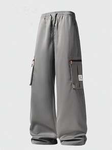 Quần cargo nam nhiều màu sắc, dáng rộng, nhẹ, phong cách đường phố ngoài trời thời trang với nhiều túi lớn và dây rút ở eo, phù hợp cho các hoạt động thể thao ngoài trời và mặc hàng ngày, món đồ thiết yếu đa năng cho mùa xuân. - Xám - Xem 9