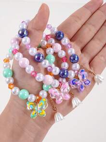 1 pulsera de niña con cuentas y dijes de mariposa y lirio del valle - Multicolor - Ver 4