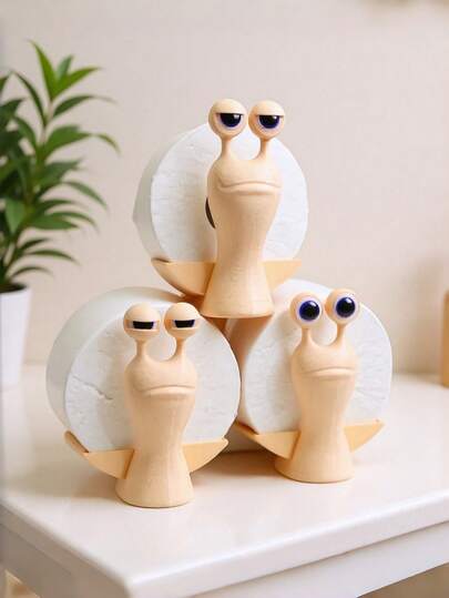1PC Snail-Shaped Sanitary Paper Holder With Three Facial Expressions. A Set Of Snail Components Includes A Pair Of Eyes. The Paper Towels Shown In The Image Are For Illustrative Purposes Only; The Product Does Not Include Paper Towels.