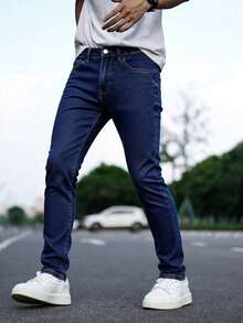 Quần jeans nam ôm sát, co giãn, màu xanh đậm, kiểu dáng cơ bản, phù hợp cho mặc hàng ngày hoặc các buổi gặp gỡ thân mật, thiết kế đơn giản dễ phối đồ. - Màu xanh lam - Xem 4