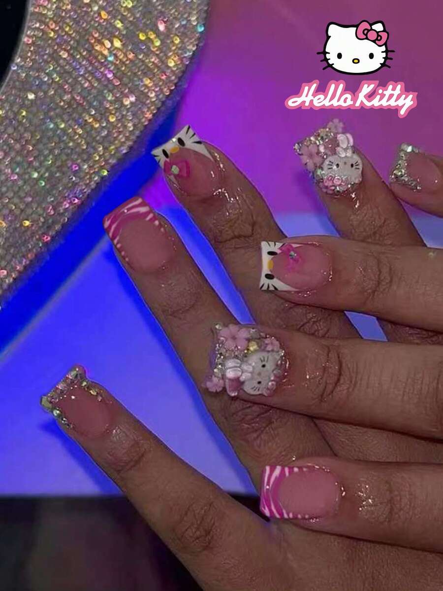 SANRIO 24片短方形3D闪粉凝胶美甲贴纸，包含可爱的3D蝴蝶结、花朵、水钻和豹纹装饰，粉色少女风，完美贴合假指甲，内含1瓶胶水和1个指甲锉，适合日常和派对场合。 - 彩色 - 查看 1