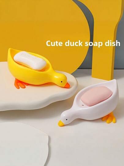 自排水鸭形皂碟 - 塑料椭圆形浴室/淋浴皂架，可爱鸭子造型，耐用塑料材质，瀑布式排水鸭形皂托，高级瀑布式皂盒，浴室塑料长方形皂架，方便清洁和收纳，易于清洁，椭圆形设计，适用于浴室和厨房装饰，趣味十足，可放置香皂条