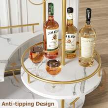 Muebles de bar, carrito para vinos, botellero de 3 niveles, ovalado, base blanca, estructura metálica dorada, construcción en gres porcelánico y metal. - Dorado - Ver 5