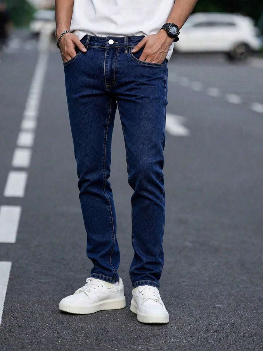 Quần jeans nam ôm sát, co giãn, màu xanh đậm, kiểu dáng cơ bản, phù hợp cho mặc hàng ngày hoặc các buổi gặp gỡ thân mật, thiết kế đơn giản dễ phối đồ. - Màu xanh lam - Xem 1