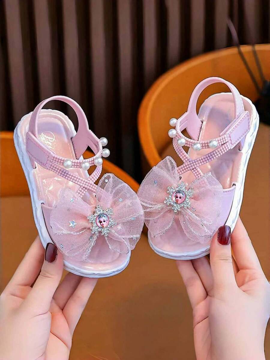 Sandal hở mũi đính nơ đá lấp lánh dễ thương cho bé gái, giày đi biển thoáng khí. - Màu Hồng baby - Xem 1