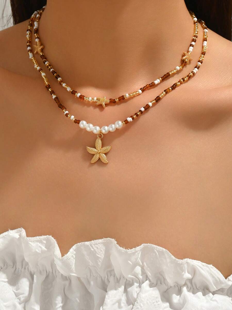 两件套时尚百搭手工串珠项链,搭配简约金色海星吊坠,优雅女士项链,适合日常佩戴、约会、派对和旅行。串珠颜色随机排列。 - 彩色 - 查看 1