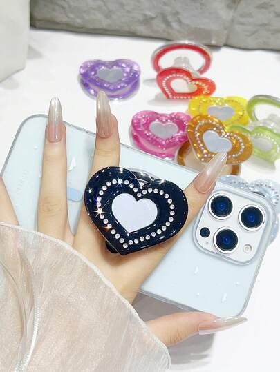 一款带有磁吸气囊滑动支撑的爱心镜，设计创意可爱，带有水平仪，风格独特。它是一款可伸缩滑动的桌面支架，手感舒适。