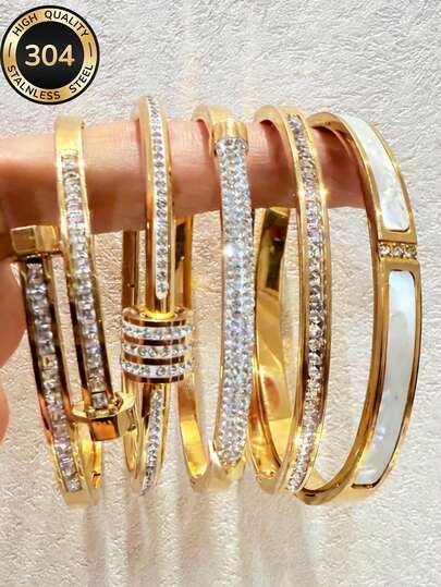 Joyería de acero inoxidable 304 chapada en oro de 18K con elementos populares como diamantes totalmente empedrados, líneas multicapa, diseños brillantes y elegantes