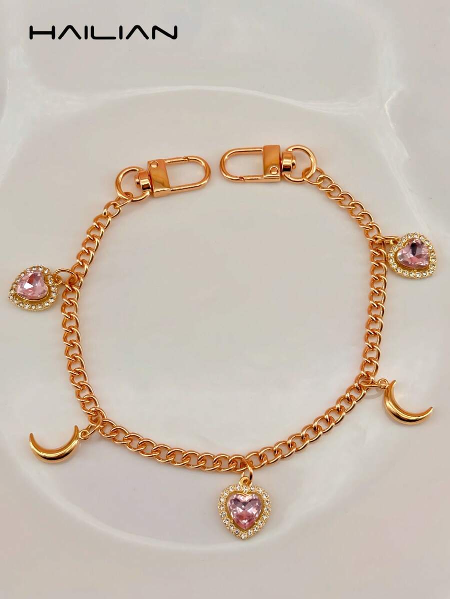 HAILIAN Esta correa de bolso de aleación está adornada con corazones de rhinestone de colores y colgantes encantadores, que incluyen una luna brillante, una cereza cristalina, una mariposa de color degradado y gotas de lluvia neón vibrantes. Se puede usar como correa de bolso, accesorio de bolso o cadena de extensión para su bolso. Por supuesto, también es un pequeño regalo de estilo para familiares, amigos o seres queridos durante las vacaciones. - Rosa - Ver 1