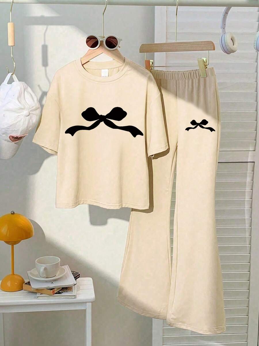 Bộ 2 món gồm áo thun ngắn tay dáng rộng và quần short mùa hè, thích hợp cho đi học, chơi thể thao và các hoạt động ngoài trời. - Màu be - Xem 1