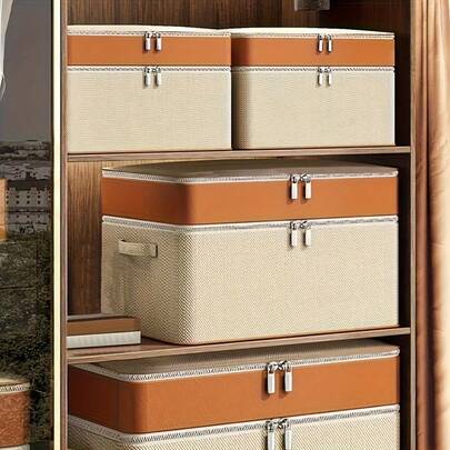 Esta es una bolsa de almacenamiento de ropa y edredón de doble capa y reforzada. Tiene un diseño plegable multifuncional y un compartimento interno. Está hecha de material de fibra de poliéster grueso y viene con un asa reforzada.