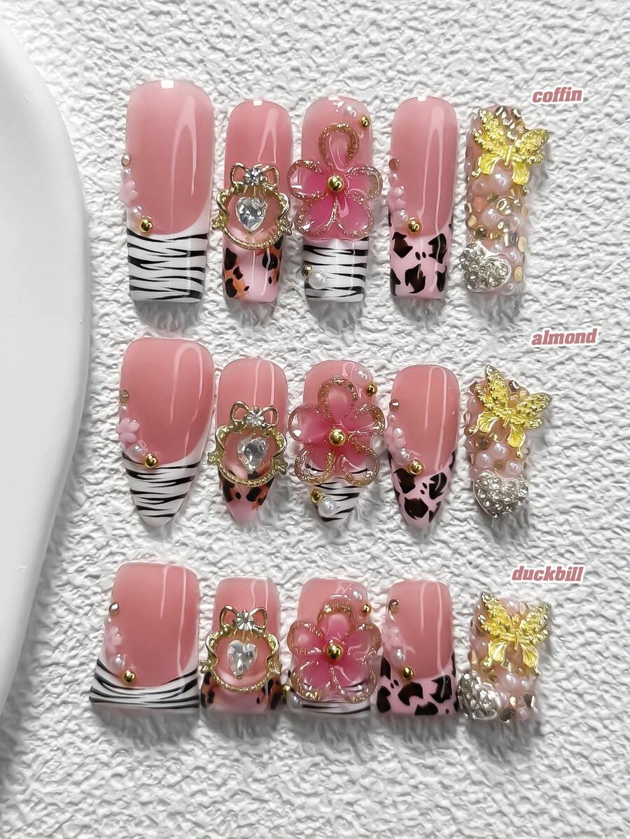 10件套奢华网红风亚克力美甲套装，包含亚克力美甲贴纸、金色镂空水钻装饰、金色蝴蝶、手工五瓣渐变粉色花朵、黑色豹纹、树枝美甲装饰，是送给女性和女孩的理想美甲礼物，套装内含美甲工具和美甲用品。 - 彩色 - 查看 1