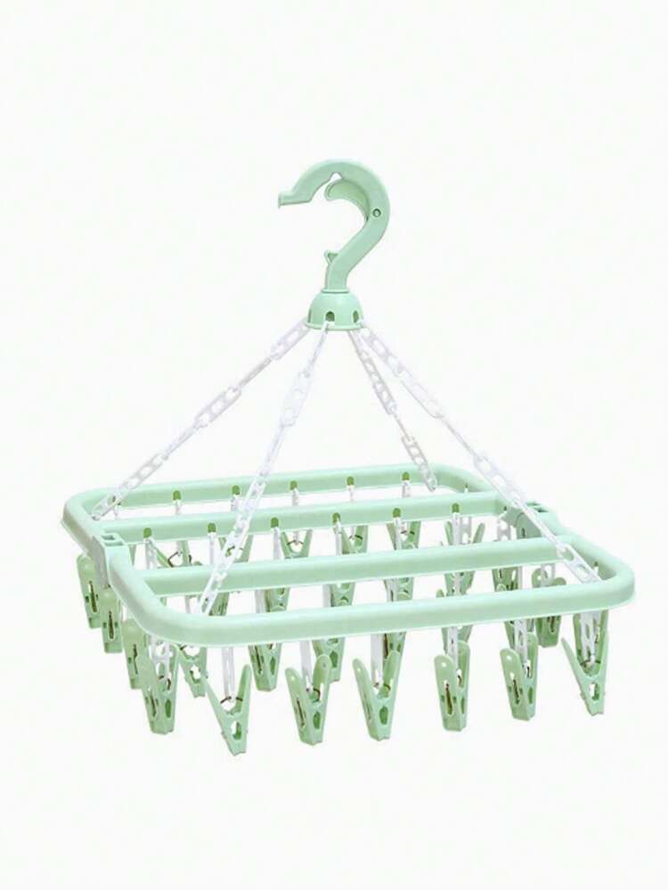 Este perchero giratorio de plástico con 32 pinzas viene con pinzas con forma de garra, pinzas para el cabello y un estante de goteo. Este perchero plegable y ahorrador de espacio es adecuado para organizar ropa, almacenar artículos del hogar y es especialmente adecuado para guardar calcetines, ropa interior, sombreros y artículos pequeños. - Multicolor - Añade 14