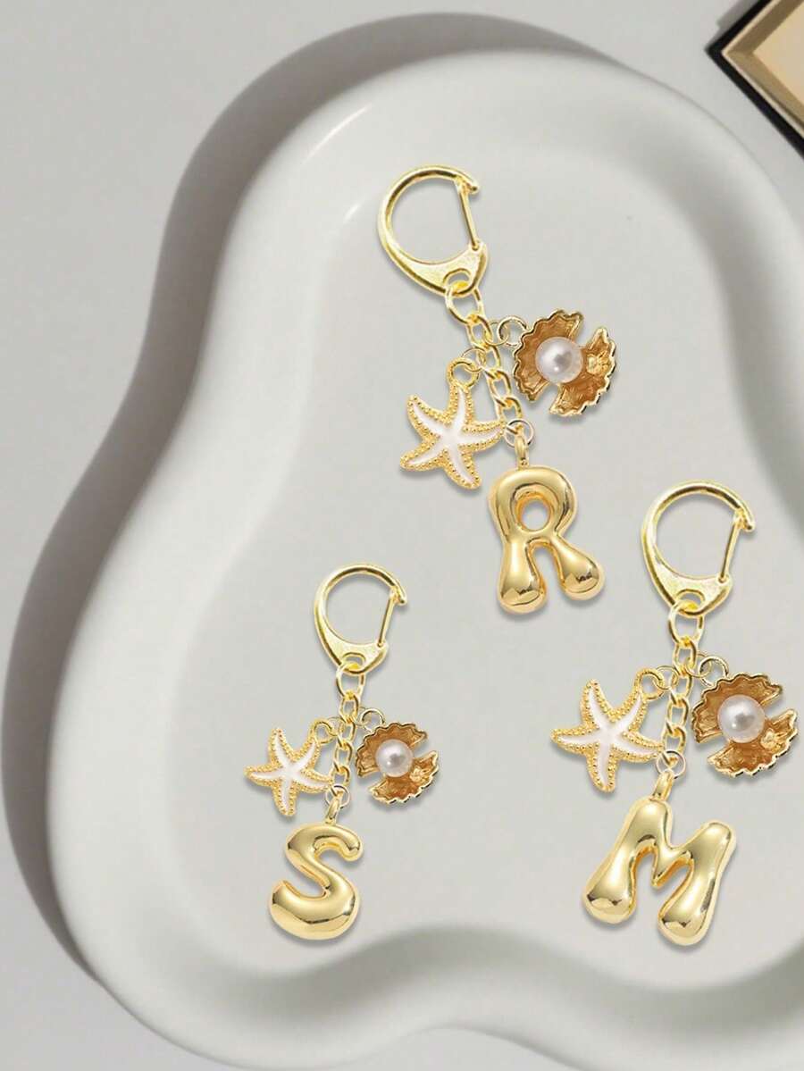 金色贝壳海星泡泡字母A-Z钥匙扣，精致包包挂件，包装配件，手机挂件，汽车挂件，独特手机配件，简约设计，适合女士钱包和手机配件，送给朋友、家人、女朋友的礼物，户外配件 - 彩色 - 查看 1