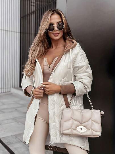 Kurtka zimowa damska, płaszcz z kapturem i ociepleniem, średniej długości, z kieszeniami i asymetrycznym dołem, biała