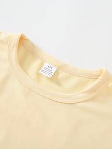 This Disney Castle And Minnie Mouse Print Crewneck T-Shirt Is Perfect For Boys And Girls To Wear To Holiday Parties, Family Gatherings, Outdoor Activities, Travel, And As A Gift For Children Visiting Disneyland. - Apricot - View 3