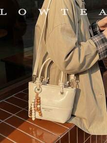 low tea 1个低茶色纯色PU皮手提包，女士复古时尚水桶包，顶部双提手设计，拉链封口，可拆卸可调节肩带，适合旅行、购物、约会、女士礼物，也适合通勤、户外活动、旅行、徒步等场合。 - 白色 - 查看 8