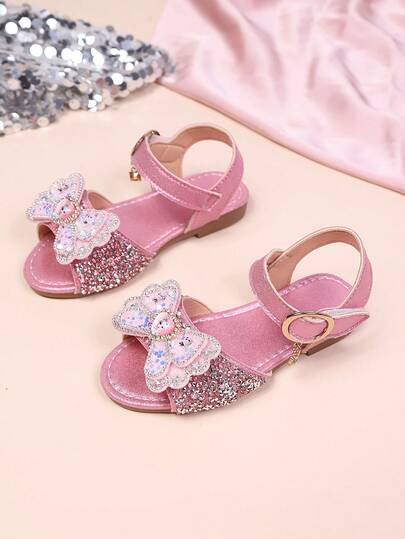 1 par de sandalias vintage para niñas con lazo hueco y diamante de imitación, estilo dulce, suela de goma antideslizante de verano nueva, puntera abierta transpirable y de moda, adecuada para fiestas, vacaciones, sandalias de playa con suela suave y antideslizante