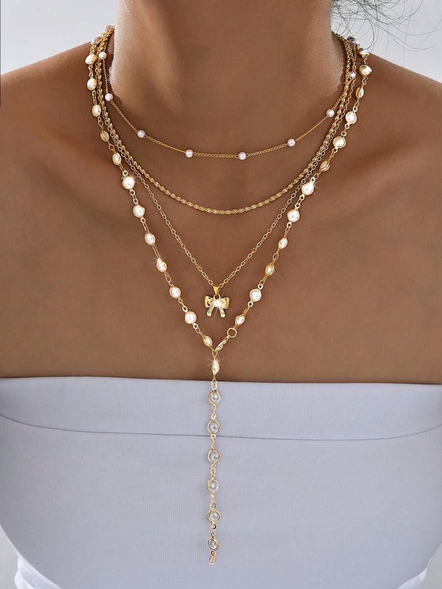 4件套复古朋克波西米亚风人造珍珠蝴蝶结Y型项链套装，优雅设计，适合女性日常、通勤、派对、约会等场合，也是送给女友或母亲的礼物。