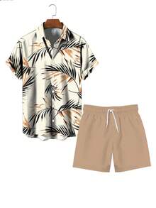 Bộ đồ nam phong cách Hawaii gồm áo thun in hình lá cọ và quần short có dây rút, thoải mái và năng động. - Nhiều màu - Xem 3
