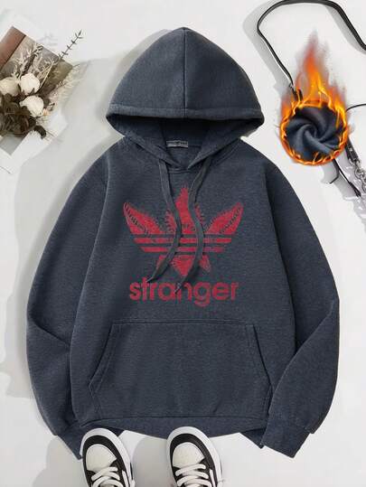 Estampado con boca de monstruo roja y letras <<extraño». Sudadera con capucha unisex para otoño/invierno Con un forro extra grueso y cálido, cordón ajustable y bolsillos en las mangas largas. Confeccionada en algodón y terciopelo.