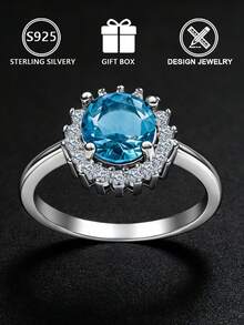 Anel feminino geométrico em prata de lei S925, com zircônia cúbica azul redonda cravejada em pavé, tamanho ajustável, ideal para uso diário ou para presentear, perfeito para noivado. Acompanha caixa para presente. - Prata - Ver 4